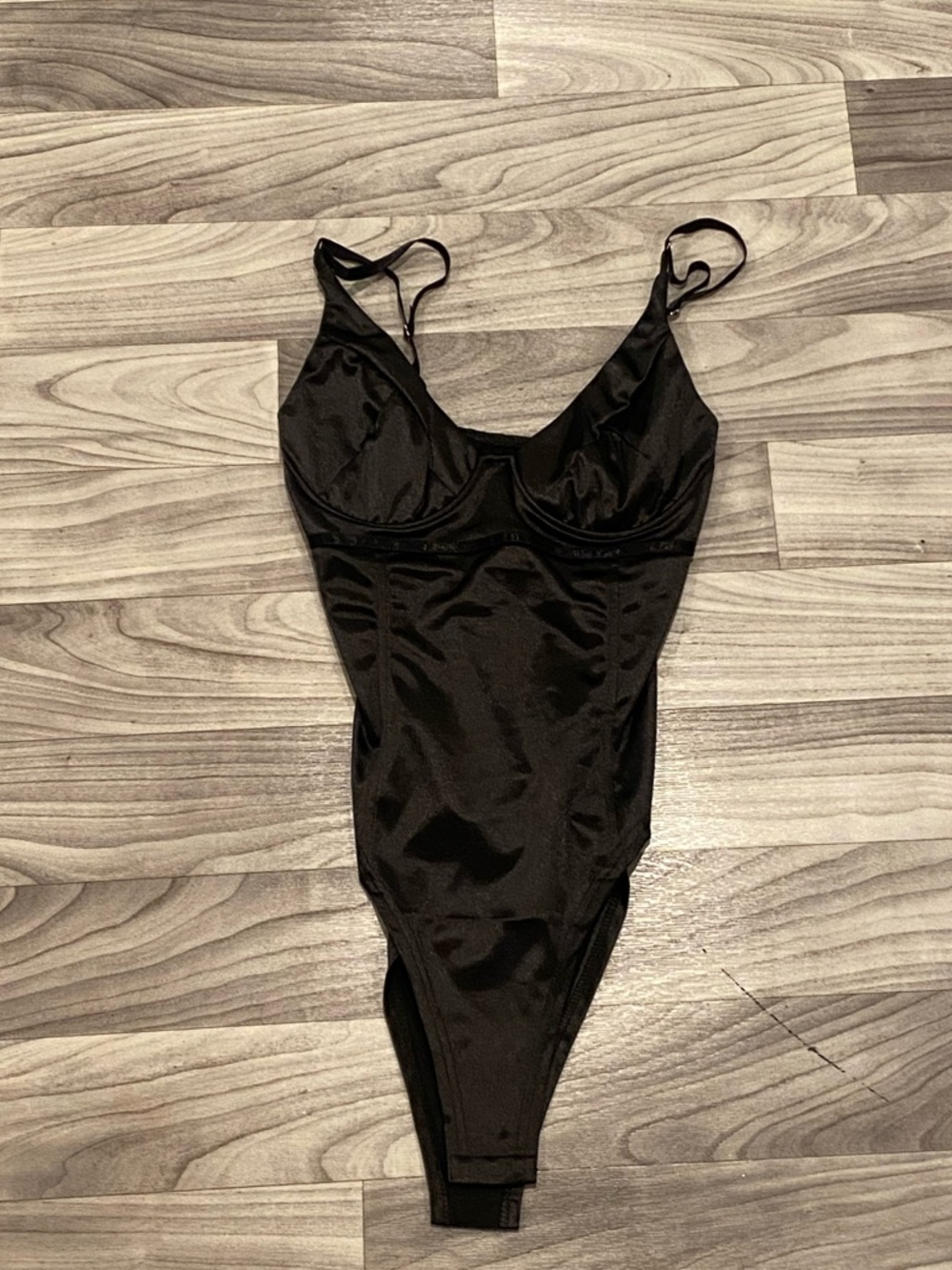 Woman’s black leather bodysuit size medium